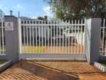 Palisade fence painted white